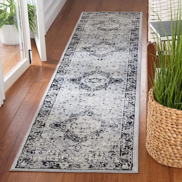 Brentwood 2 ft. x 9 ft. Black/Ivory Diamond Medallion Border Runner Rug