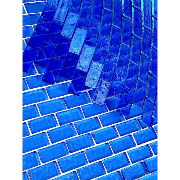 https://images.thdstatic.com/productImages/1c3fca6e-a7d2-4f10-b437-c28a305a94a4/svn/ocean-blue-glossy-abolos-glass-tile-ghmffl0102-ob-c3_600.jpg