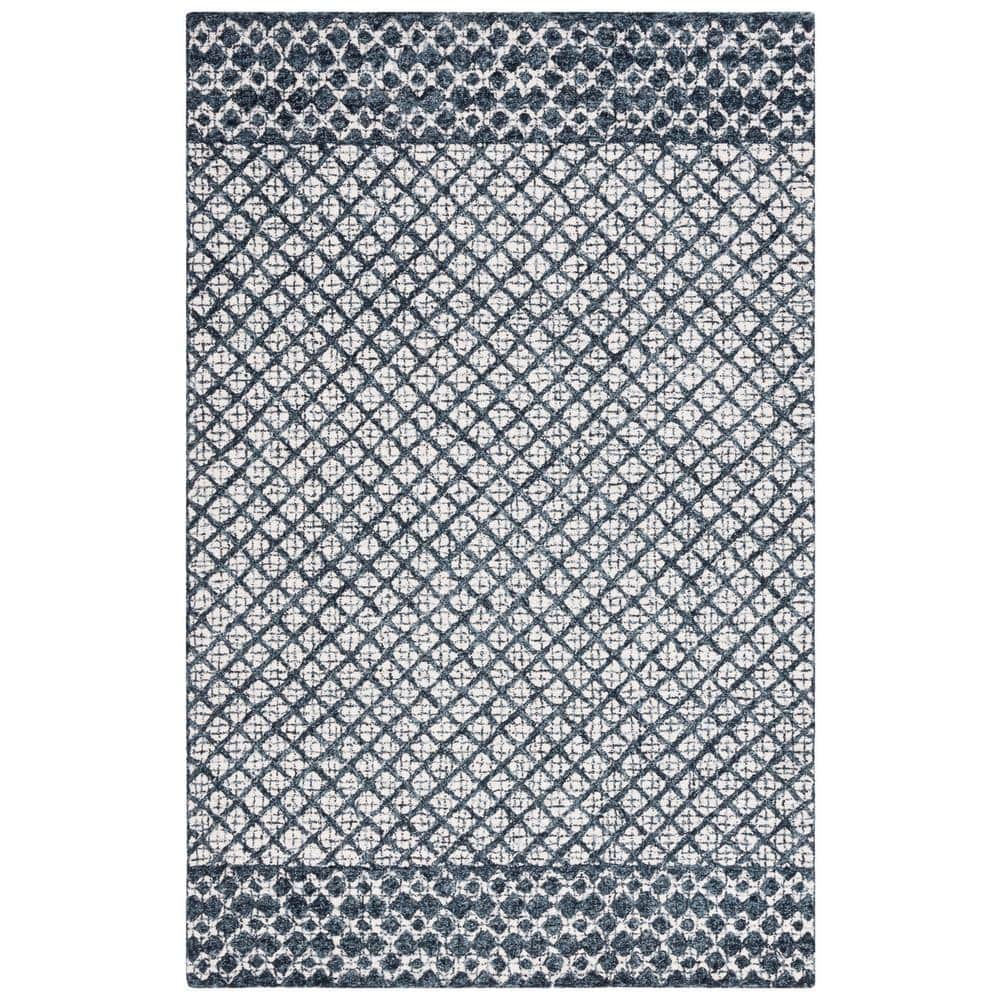 Ivory and Navy Tufted Wool Abstract Area Rug