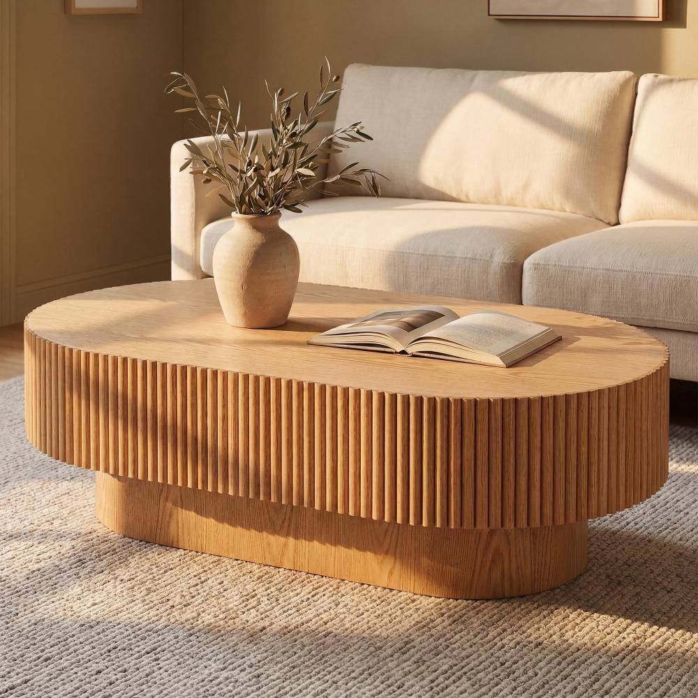 Natural wood fluted coffee table in a styled living room environment.