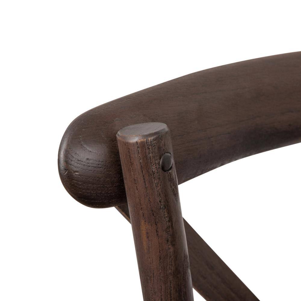 Close-up of the wooden frame and joinery of a side chair.