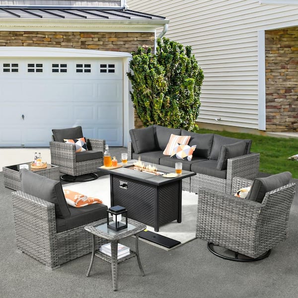 XIZZI Harlotte 9-Piece Wicker Patio Rectangular Fire Pit Set with Black Cushions and Swivel Rocking Chairs