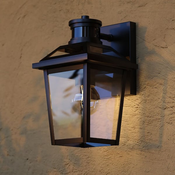 Hanover Park 10.5 in. H Textured Black Motion Sensing Dusk to Dawn Outdoor Wall Sconce Light, Clear Glass Shade