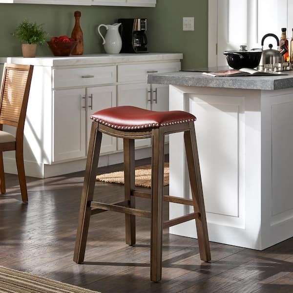 HomeSullivan 30.2 in. Red Faux Leather Saddle Seat Backless Wood Frame Bar Height Stool