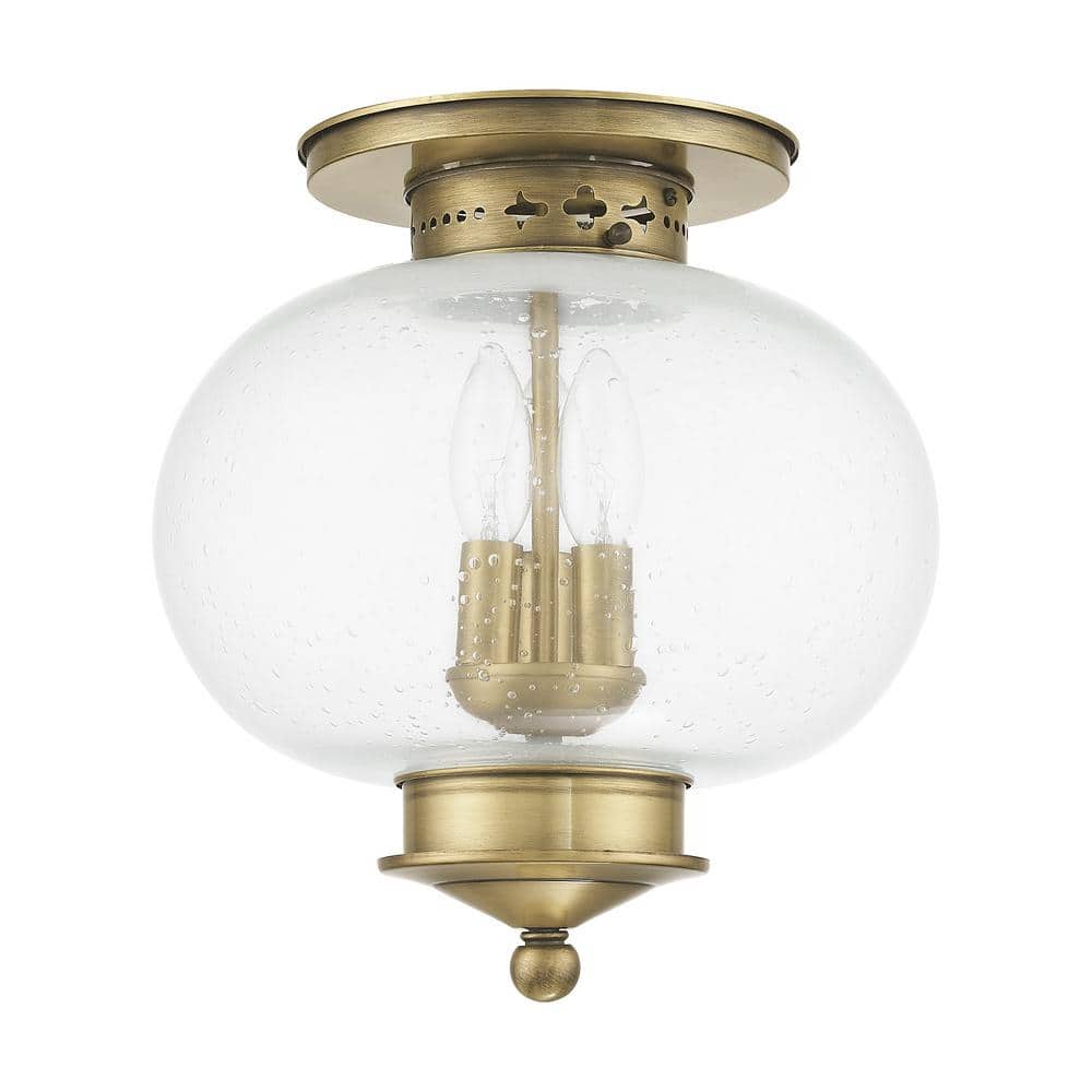Harbor Antique Brass Globe LED Flush Mount with Hand Blown Seeded Glass