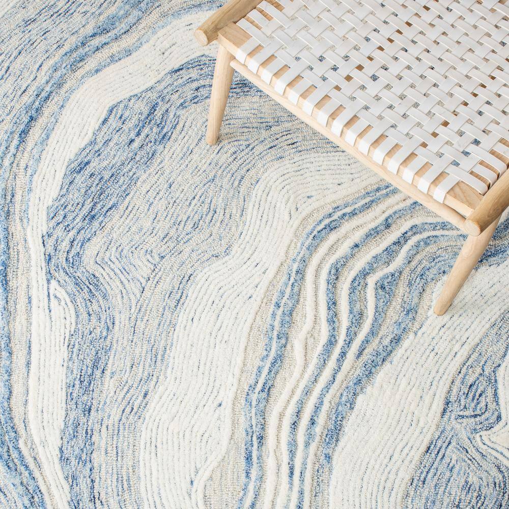 Handmade Blue and Ivory Abstract Wool Area Rug