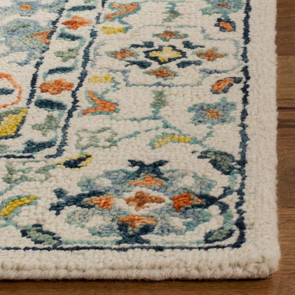 Handmade Rustic-Chic Blue Floral Wool Area Rug - 6' x 9'