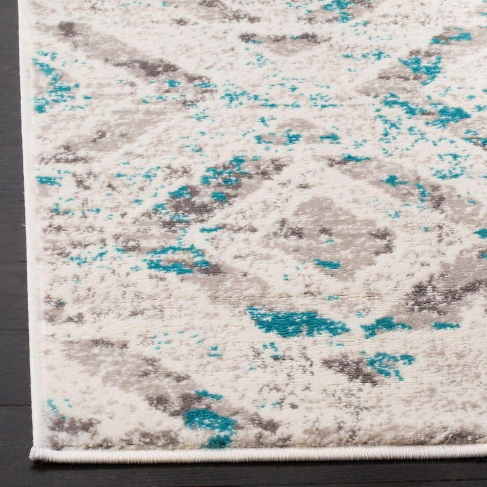 Ivory and Blue Medallion 6' x 9' Synthetic Area Rug