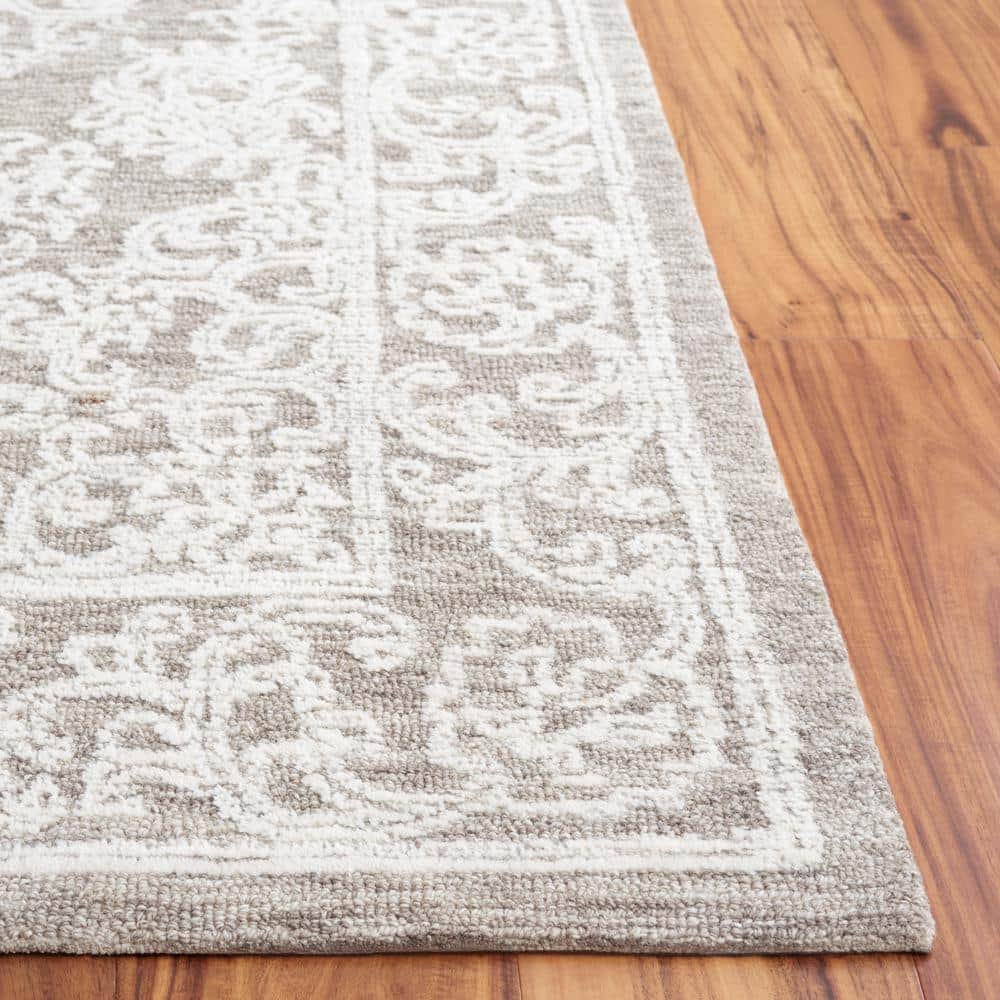Ivory and Grey 6' x 9' Hand Tufted Wool Area Rug