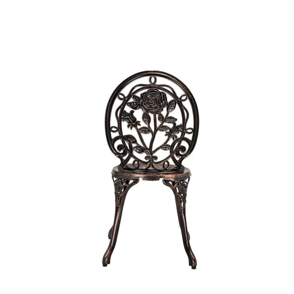Antique bronze chair with an intricate rose and leaf pattern on the backrest.