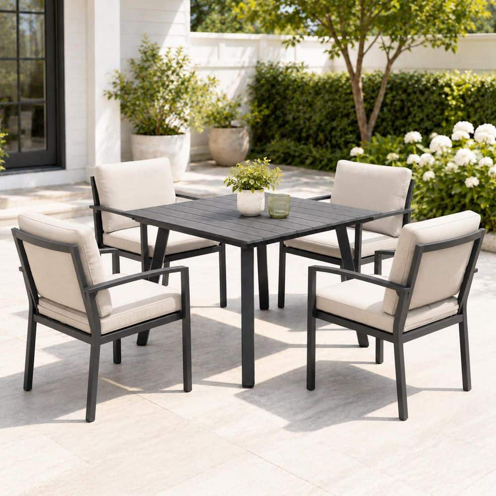 Outdoor patio set with a gray side table and chairs.