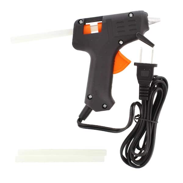 A set of hot glue gun and sticks useful for creation and DIY work Art and  craft boutique
