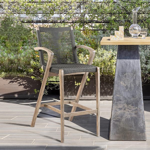 Armen Living Brielle Armed UV Protected Outdoor Light Eucalyptus Wood and Charcoal Rope Bar Height Stool with Footrest