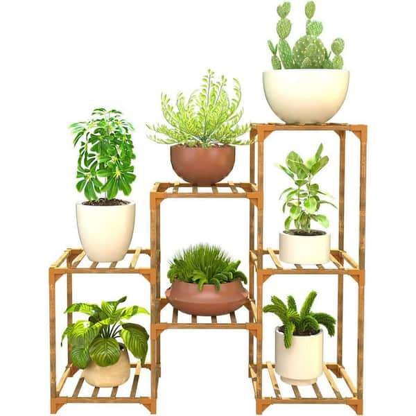 https://images.thdstatic.com/productImages/1e5c0c8a-02e8-435c-8c2c-9e88e286b198/svn/natural-walnut-plant-stands-am929c-293-fa_600.jpg