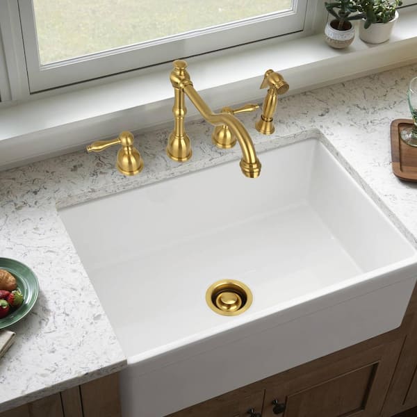 https://images.thdstatic.com/productImages/1e6bb46b-4d9c-47f4-8370-74efc70fdc63/svn/brushed-gold-akicon-sink-strainers-ak82201-btg-4f_600.jpg