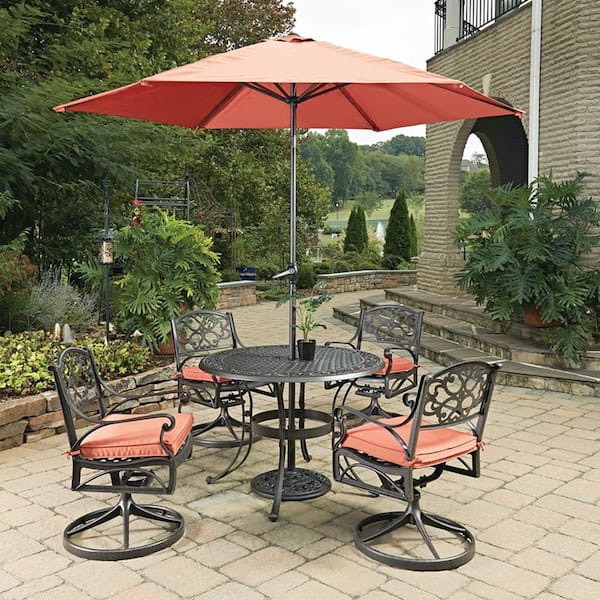 HOMESTYLES Sanibel Rust Bronze 7-Piece Cast Aluminum Round Outdoor Dining Set with Coral Cushions and Umbrella
