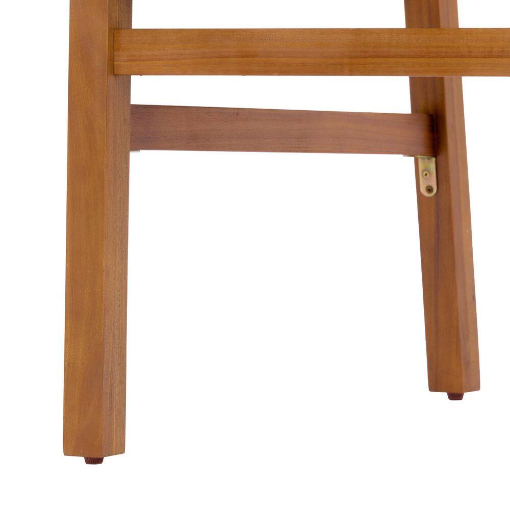 Close-up detail of the wooden frame and rope weave seat of an outdoor chair.
