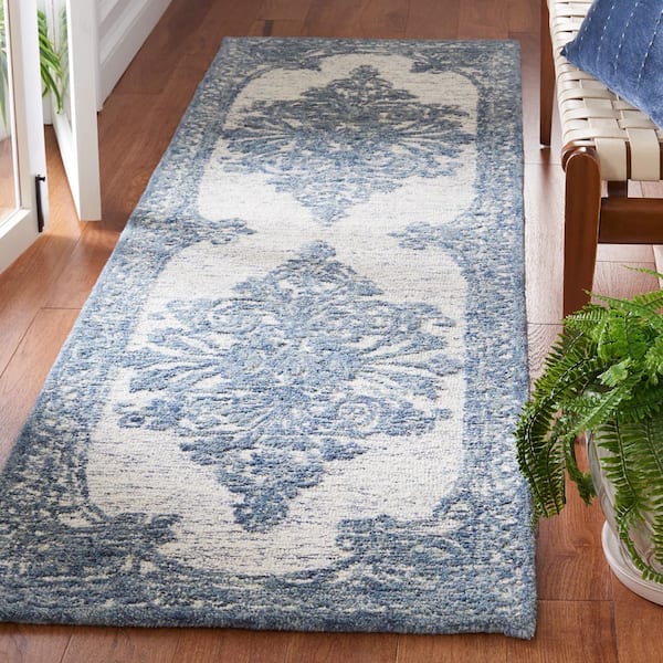 https://images.thdstatic.com/productImages/1eb7891f-09e3-40a4-a11a-3b106308d61e/svn/blue-ivory-safavieh-area-rugs-met616m-28-e1_600.jpg