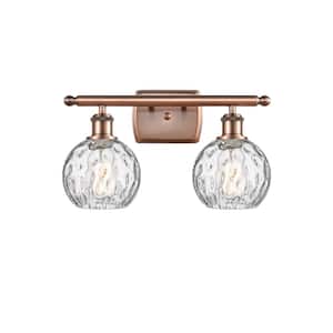 Athens Water Glass 16 in. 2-Light Antique Copper Vanity Light with Clear Water Glass Shade