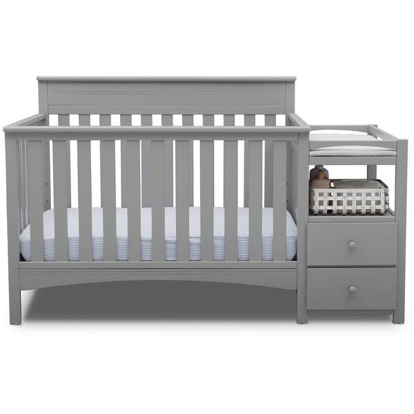 grey crib with changing table