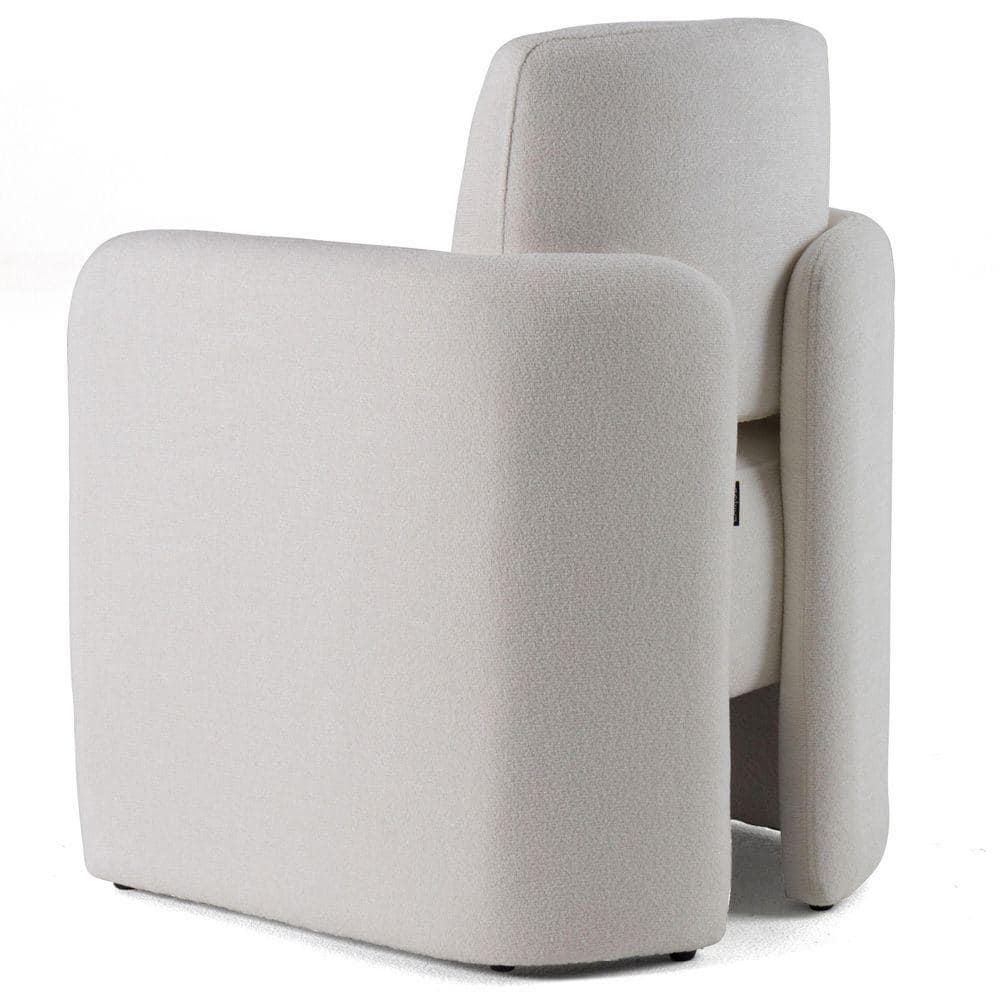 Side view of a white modern fabric armchair.