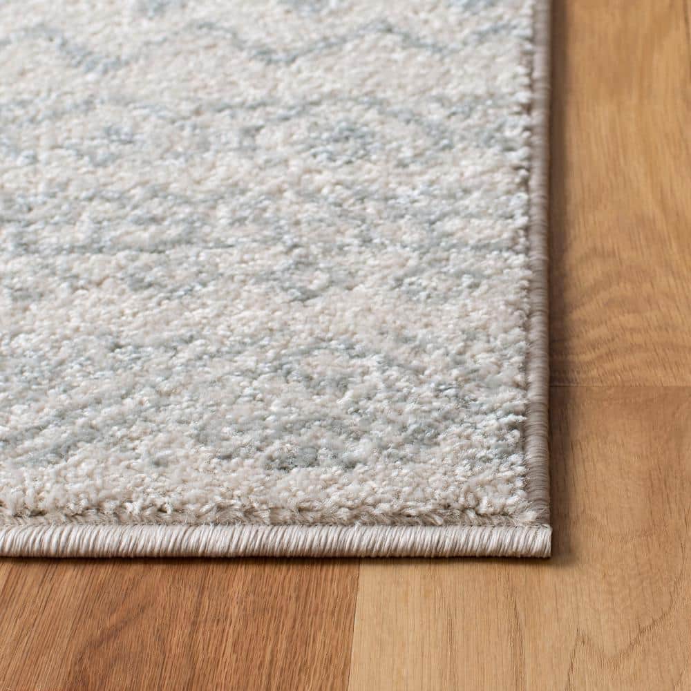 Ivory and Light Grey Geometric 6' x 9' Synthetic Area Rug
