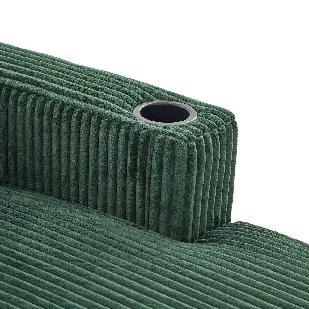 Close-up of the integrated cup holder on the emerald green sofa armrest.