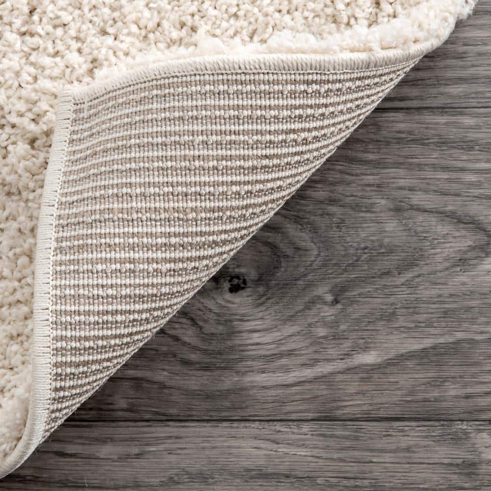Cream and Beige Synthetic Shag Area Rug, 9' 2" x 12'
