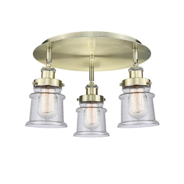 Canton 17 in. 3-Light Antique Brass Industrial Flush Mount with Seeded Glass Shade
