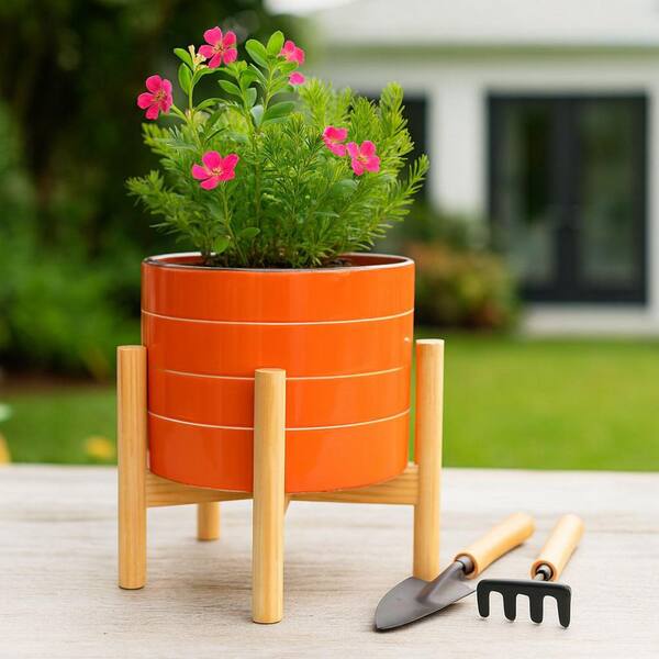 Liv & Skye Orange Ceramic Planter (8 in. W x 6 in. H) with Wood
