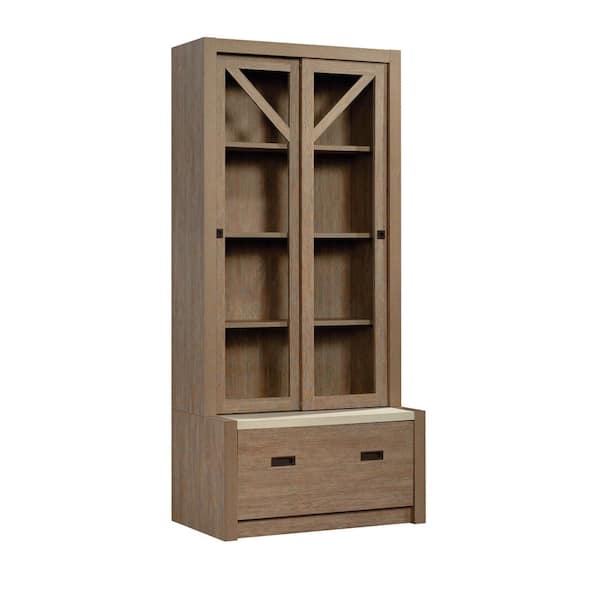 SAUDER Dixon City 32.992 in. Wide Brushed Oak 4-Shelf Standard Bookcase with Framed Sliding Doors and Drawer