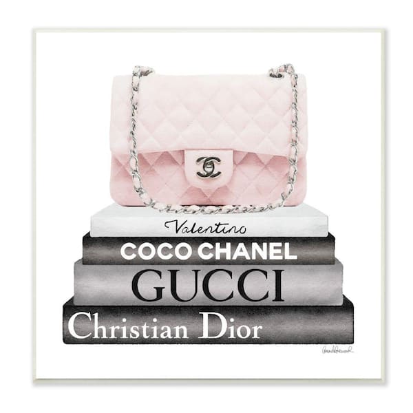 Stupell Industries "Pink Quilted Purse on Modern Chic Bookstack" by Amanda Greenwood Unframed Abstract Wood Wall Art Print 12 in. x 12 in.
