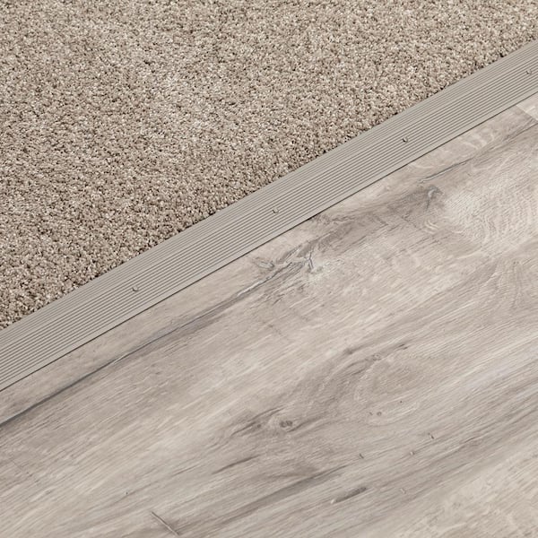 https://images.thdstatic.com/productImages/20021c12-ea35-4e09-9abe-813e02f0f982/svn/warm-gray-m-d-building-products-carpet-transition-strips-43380-1f_600.jpg