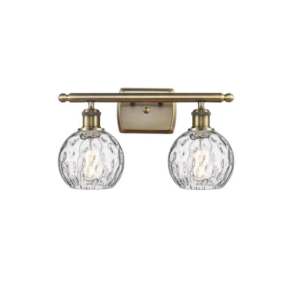 Innovations Athens Water Glass 16 in. 2 Light Antique Brass, Clear Water Glass Vanity Light with Clear Glass Shade
