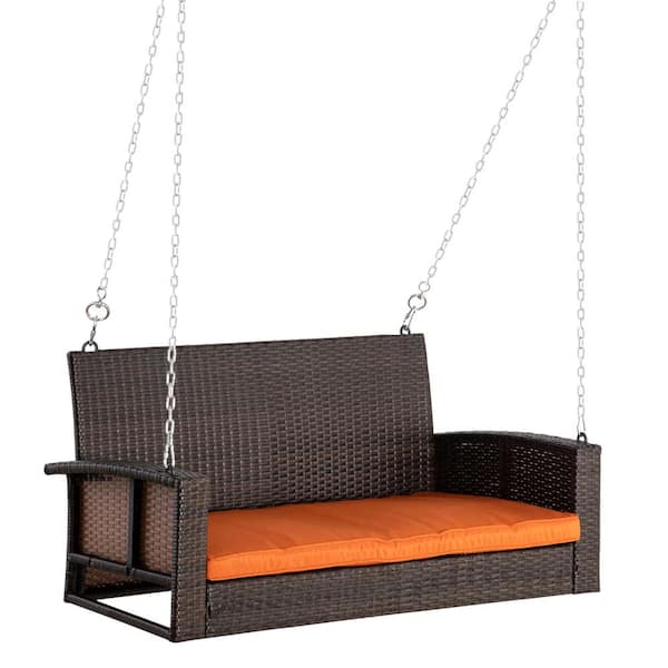 Unbranded 2-Person Brown Wicker Patio Swing with Orange Cushions