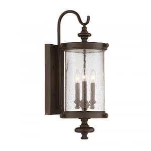 Palmer 9 in. W x 26 in. H 3-Light Walnut Patina Hardwired Outdoor Wall Lantern Sconce with Clear Seeded Glass Shade