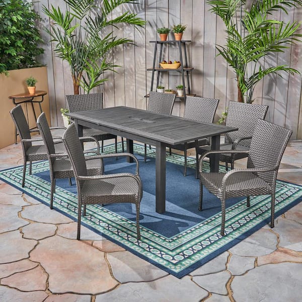 Noble House Hayes Sandblast Dark Grey 9-Piece Wood and Grey Faux Rattan Outdoor Dining Set
