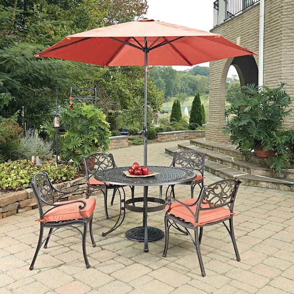 HOMESTYLES Sanibel Rust Bronze 7-Piece Cast Aluminium Round Dining Set with Coral Cushions and Umbrella