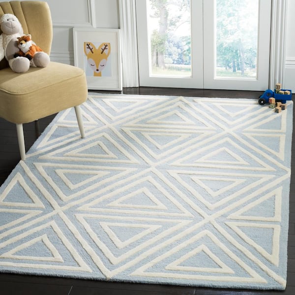 https://images.thdstatic.com/productImages/207c24e6-5861-47b6-8998-9ca19079aa9c/svn/blue-ivory-safavieh-area-rugs-sfk912e-8-e1_600.jpg