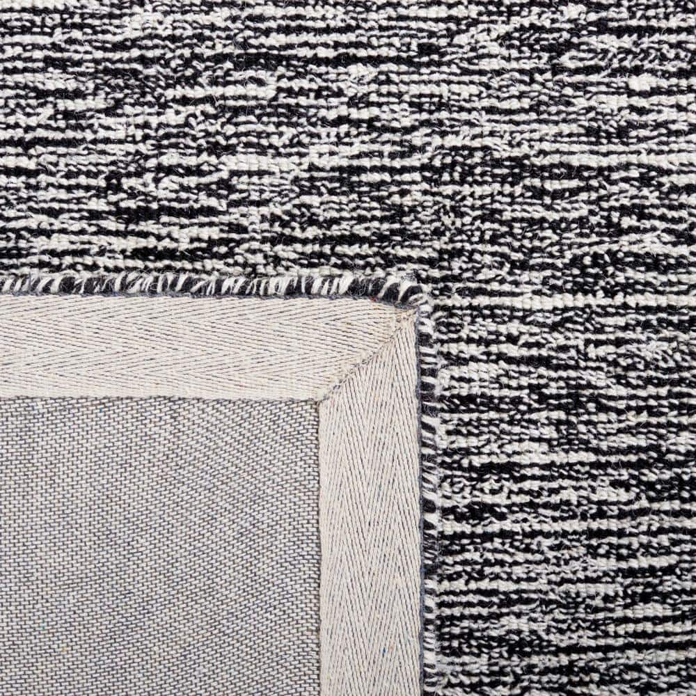 Handmade Abstract Tufted Wool Rug in Black/Ivory - 6' x 9'