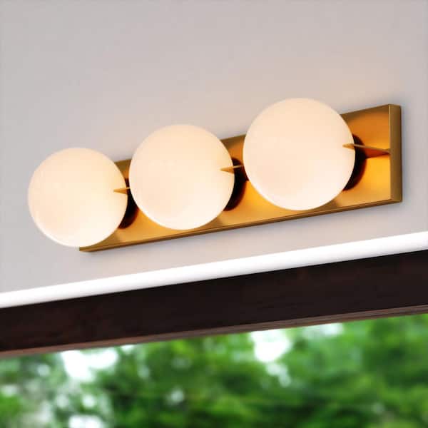VAXCEL Parkview 24 in. W 3 Light Vanity Light Gold Brass Mid-Century Modern Bathroom Wall Fixture White Glass