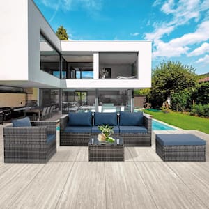 Gray 6-Piece Wicker Outdoor Sectional Set with Navy Blue Cushions and Tempered Glass Coffee Table