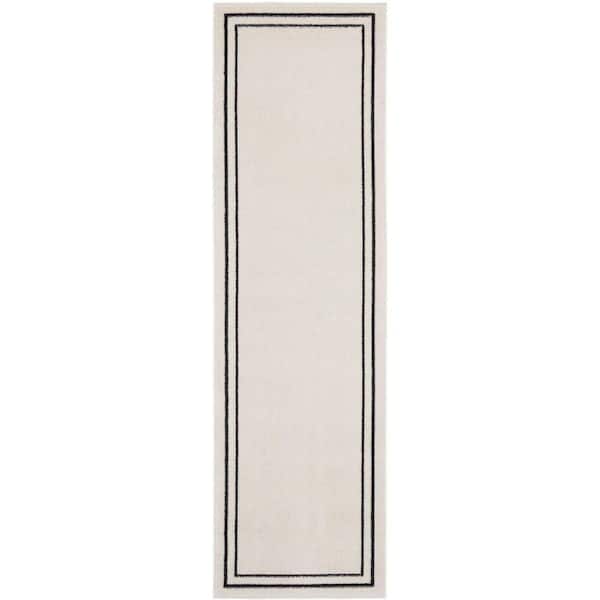 Nourison Nourison Essentials Ivory/Black 2 ft. x 6 ft. Solid Contemporary Runner Area Rug