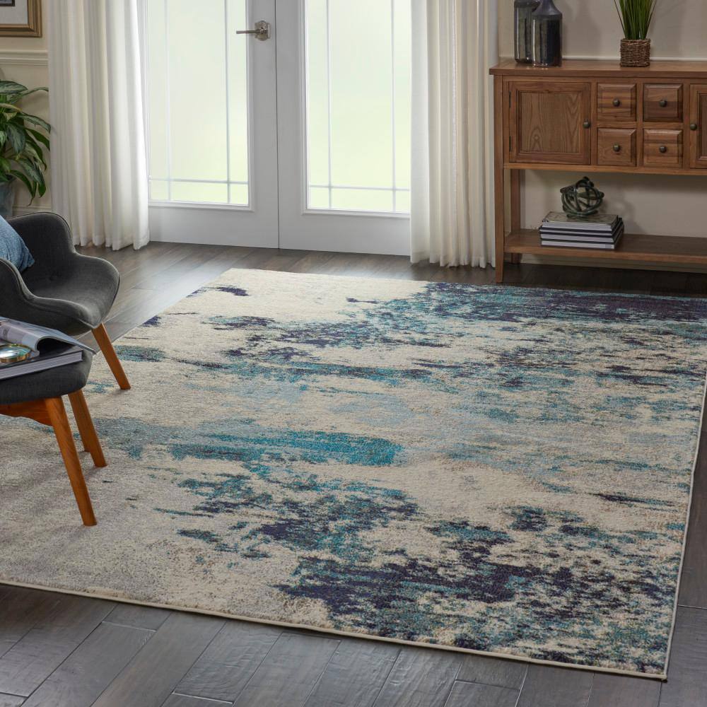 Ivory and Teal Blue Abstract 6' x 9' Synthetic Area Rug