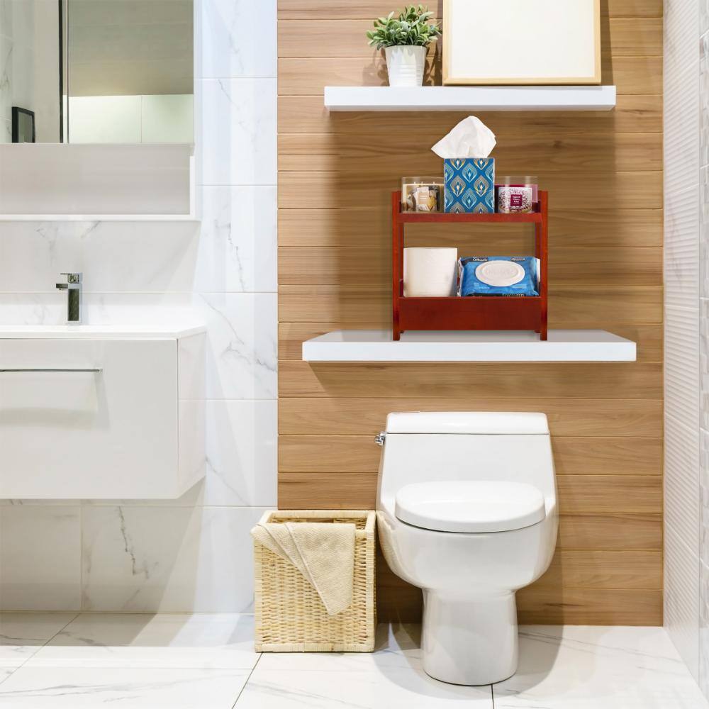 Brown bamboo shelving unit placed on a bathroom shelf above a toilet.