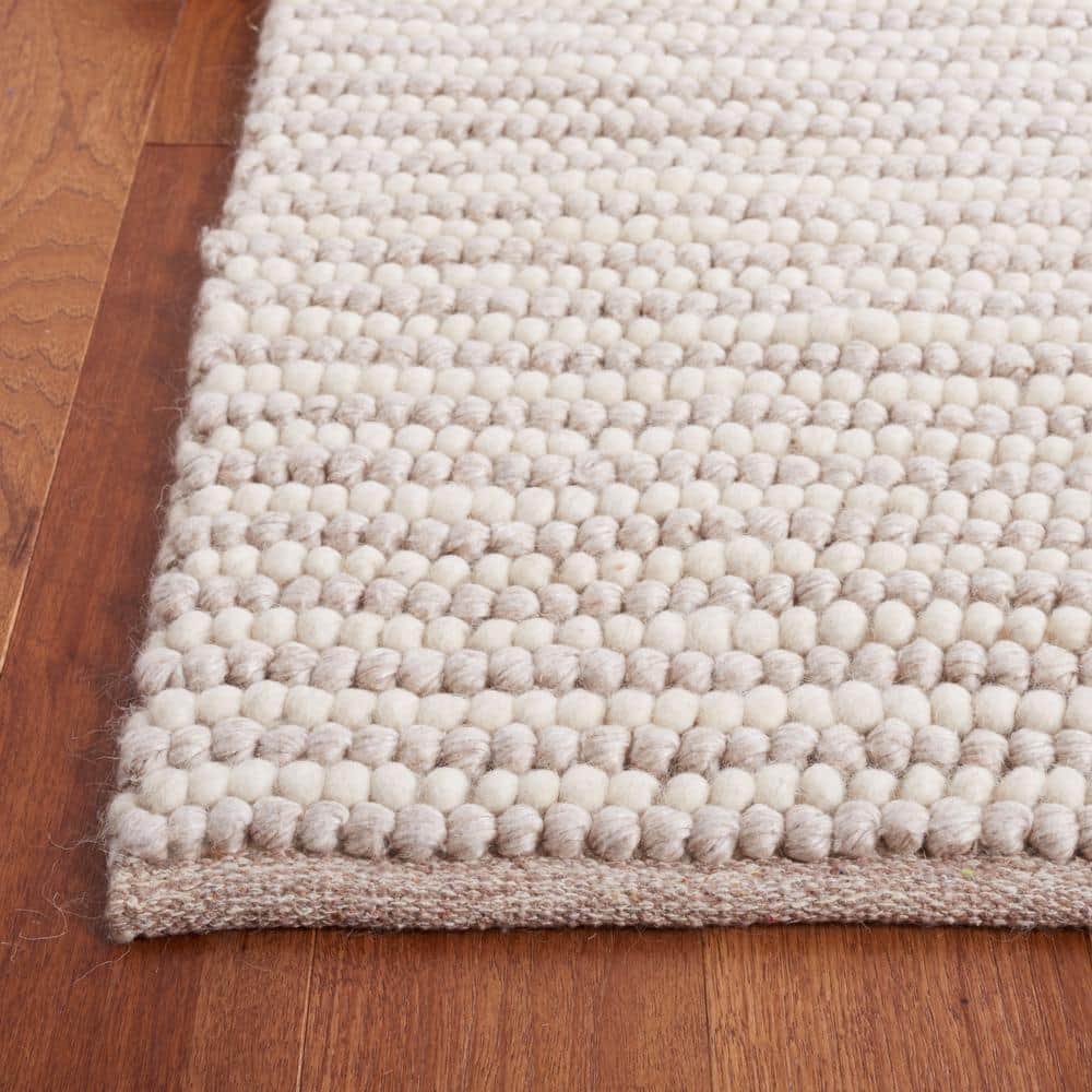 Ivory and Beige 8' x 10' Handwoven Wool and Synthetic Area Rug