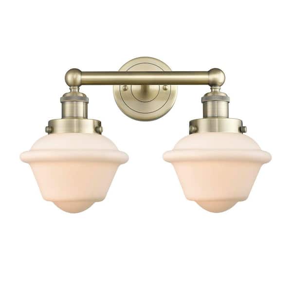 Oxford 15.5 in. 2-Light Antique Brass Vanity Light with Glass Shade