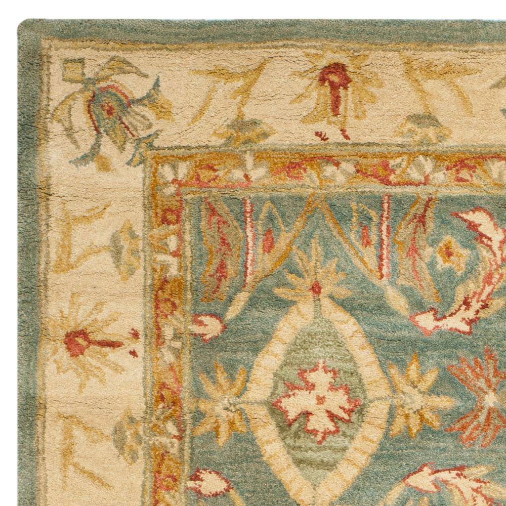 Handmade Light Blue and Ivory Floral Wool 6' x 9' Area Rug