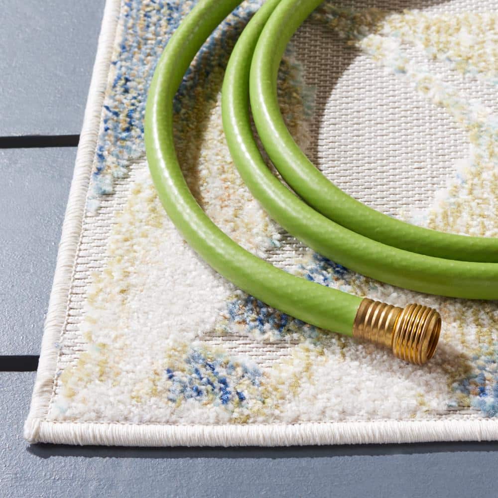 Light Green and Ivory Floral Synthetic Area Rug