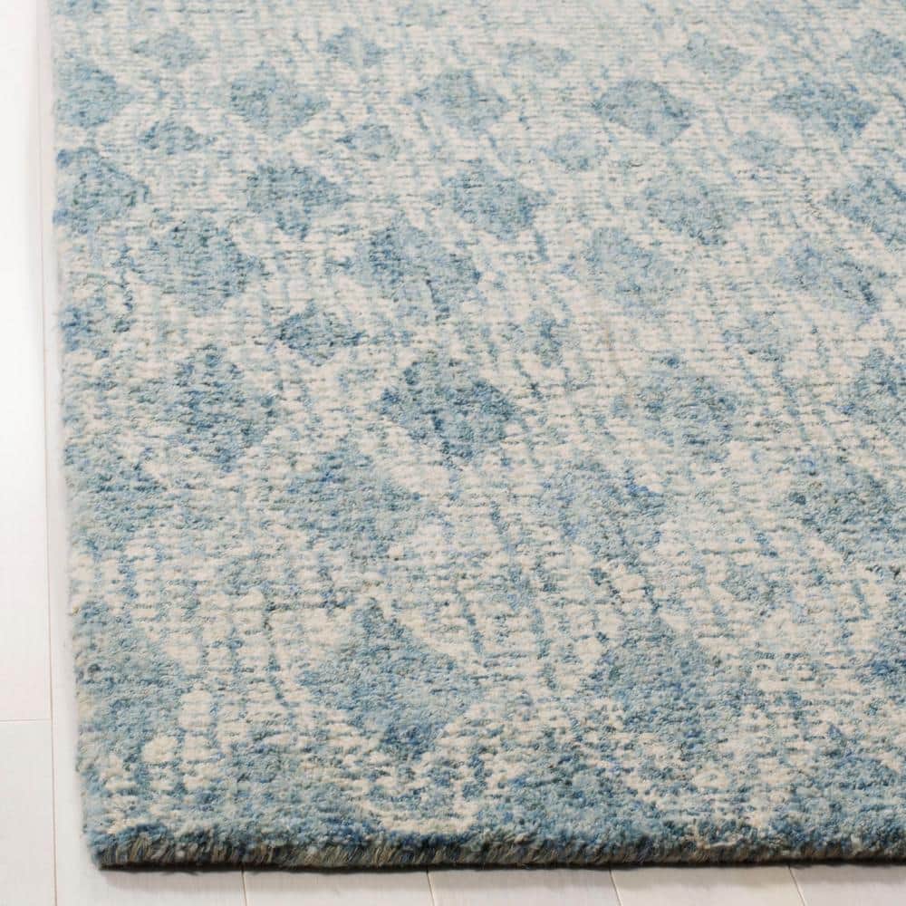 Ivory and Blue Handmade Wool Abstract Tufted Rug, 5' x 8'